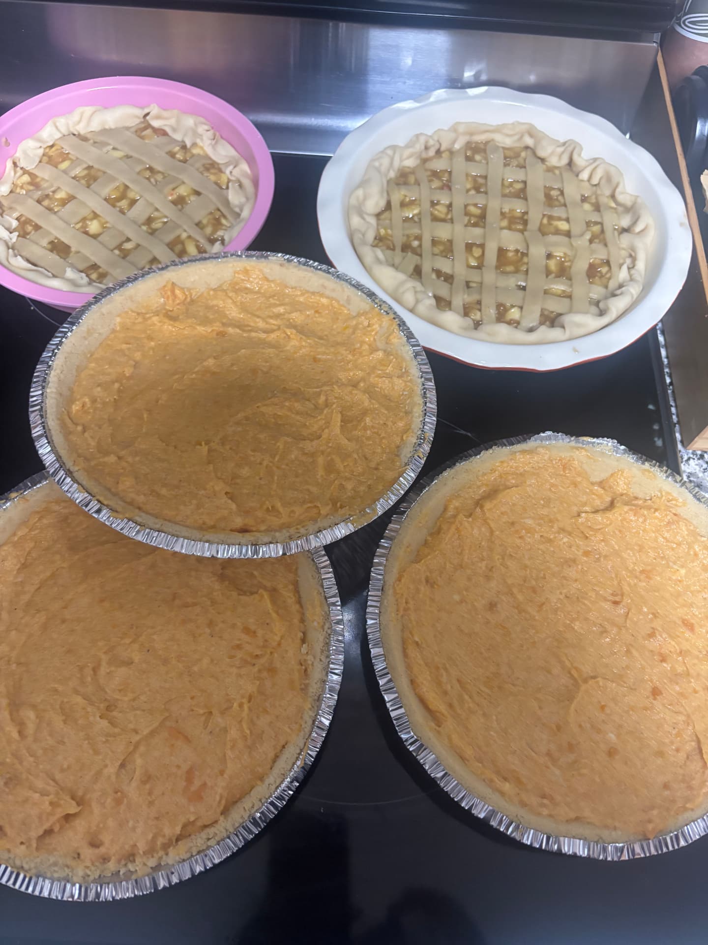 A batch of apple and sweet potato pies ready for the oven
